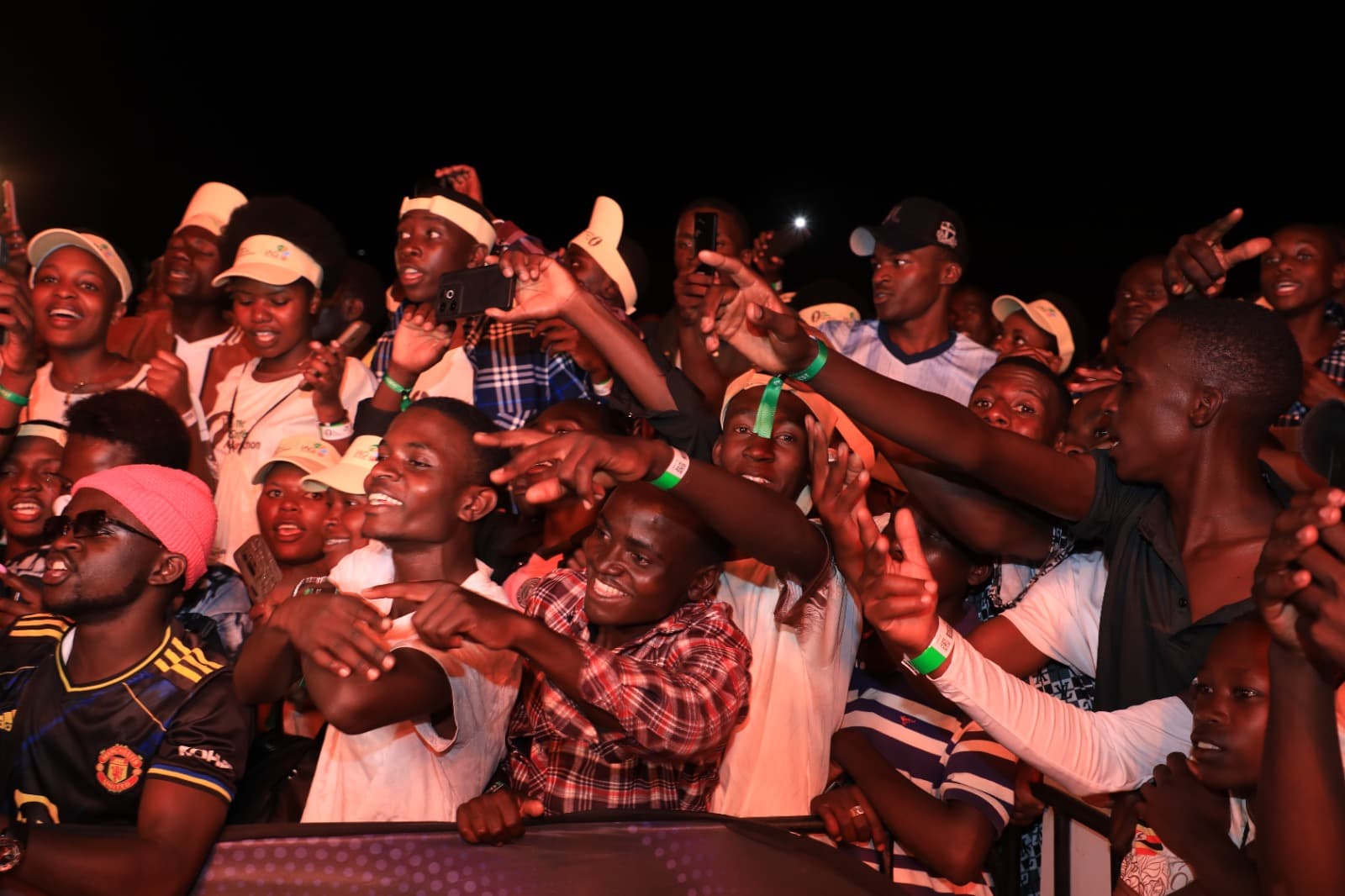 Fans cheering at the front barrier during the Coffee Fest concert